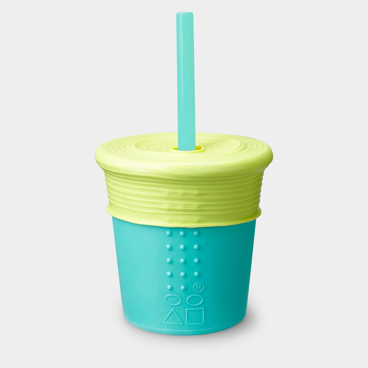 Child using a GoSili reusable silicone straw cup at the park, enjoying a spill-proof drink.
