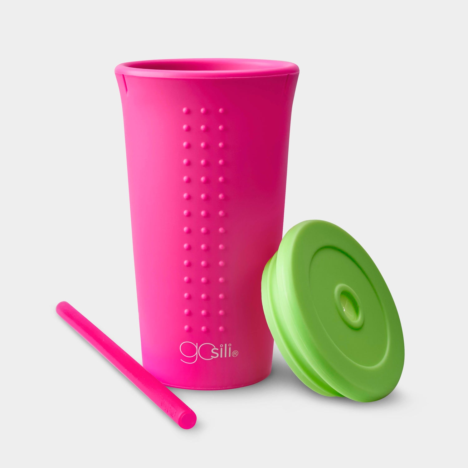 Person enjoying a beverage in a GoSili reusable silicone cup with a soft silicone straw.